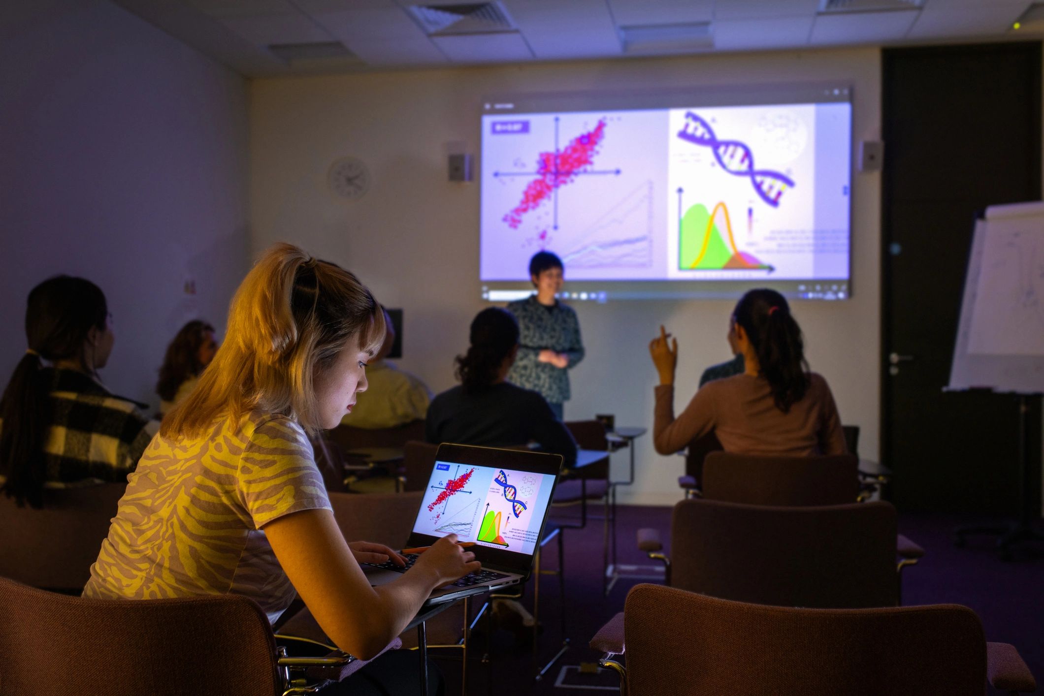 Healthcare education session with clinicians reviewing scientific information