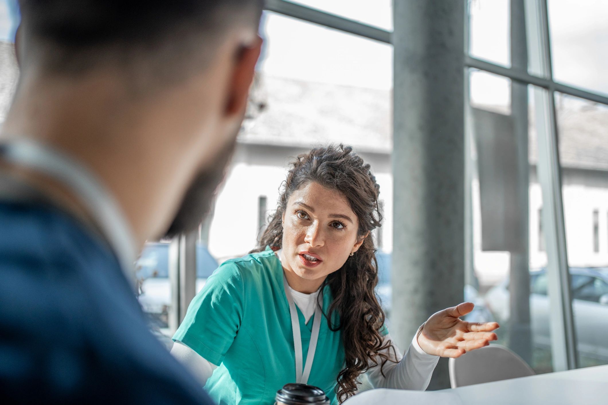 Healthcare professionals discussing clinical care in a modern clinic