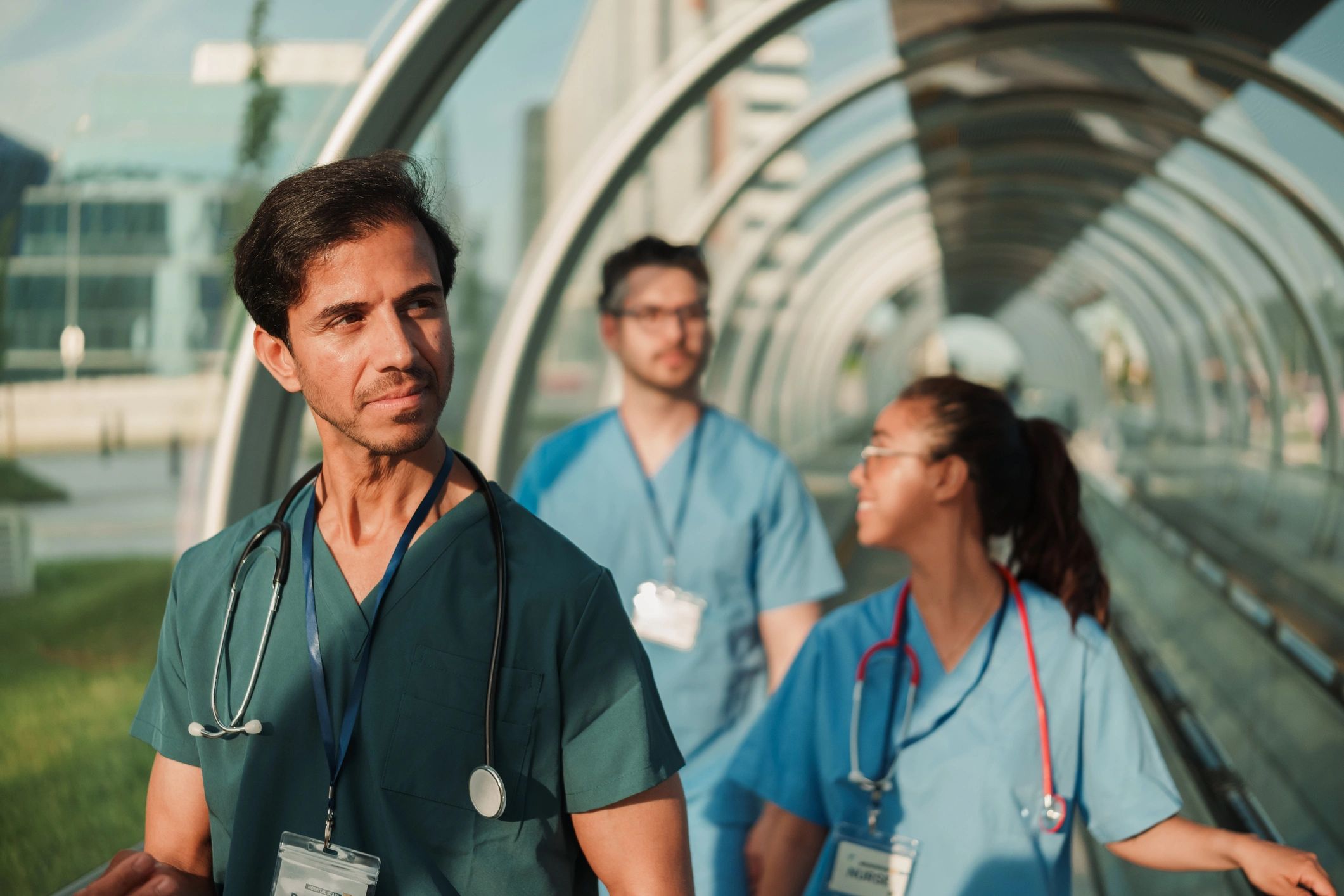 Medical professionals collaborating in a hospital corridor